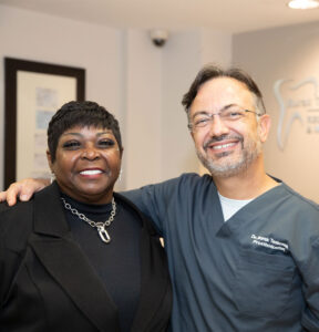 Dr. Burak Taskonak with a dental patient.
